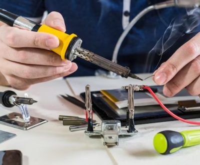 horizontal-shot-male-hands-soldering-cable-electronic-device-wire_665346-78863